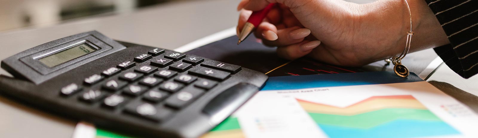 Lady using a calculator for finances