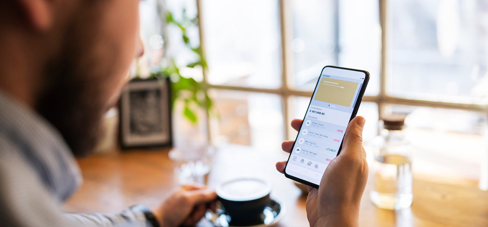 Man using his mobile banking app on his smartphone