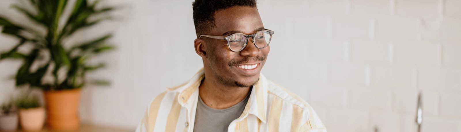 Smiling man in his kitchen