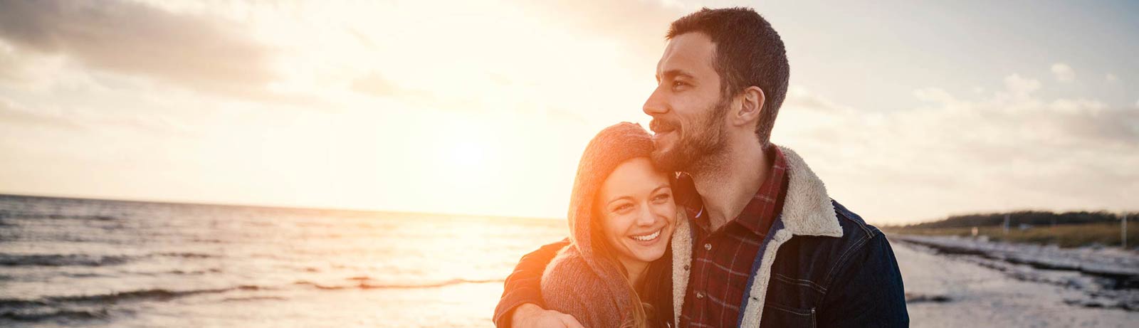 A young couple on vacation at a beach